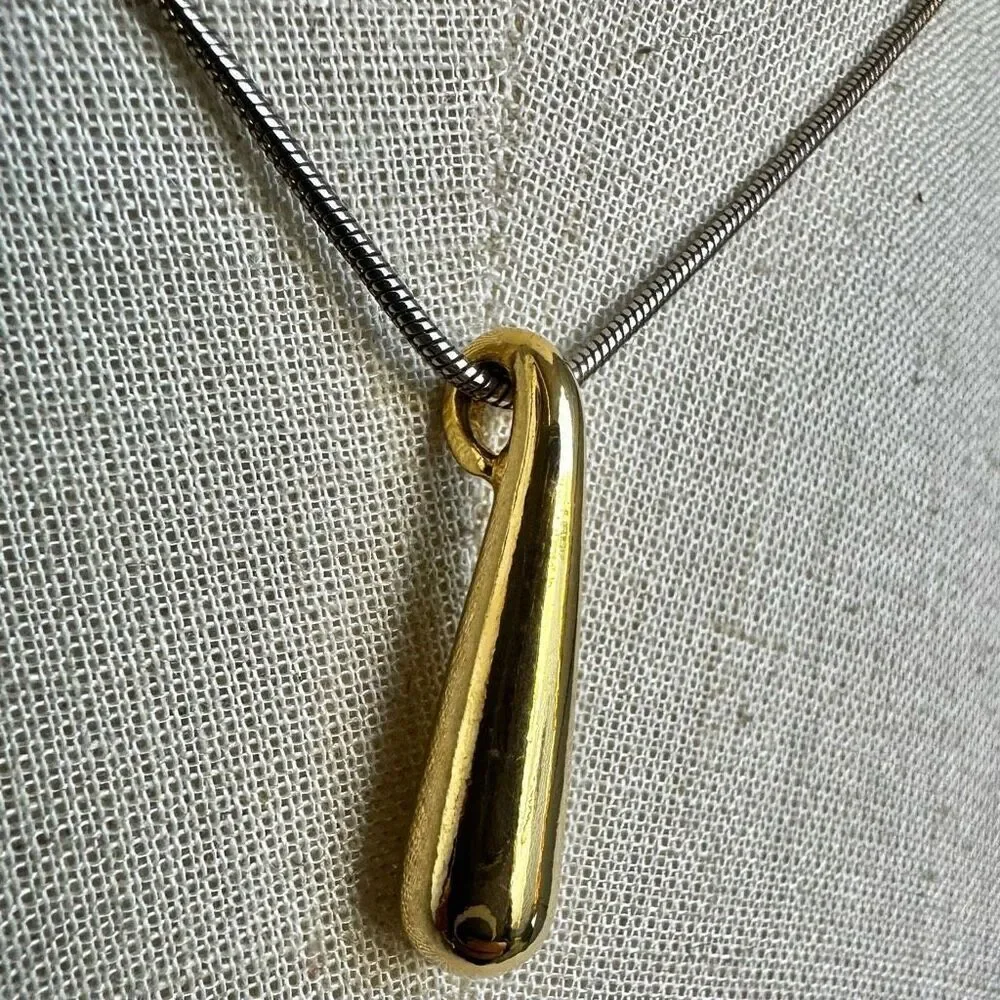 Gold tone pendant necklace